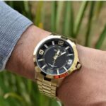 Relógio Technos Racer Masculino Dourado: estilo esportivo e sofisticado para compor looks com elegância. - Imagem 7
