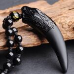 Colar Dente de Predador em Obsidiana Negra: proteção espiritual, força e equilíbrio, 70cm, unissex, com bolsa de veludo - Imagem 8