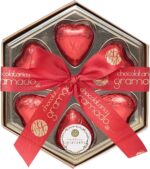 Caixa Sextavada com Corações de Chocolate ao Leite 38% Cacau: presente artesanal de Gramado, sabor aveludado e elegante embalagem de 42 g